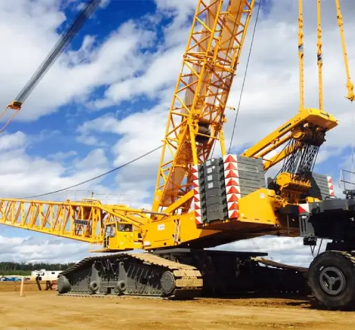 Heavy cranes lifting concrete bridge girders